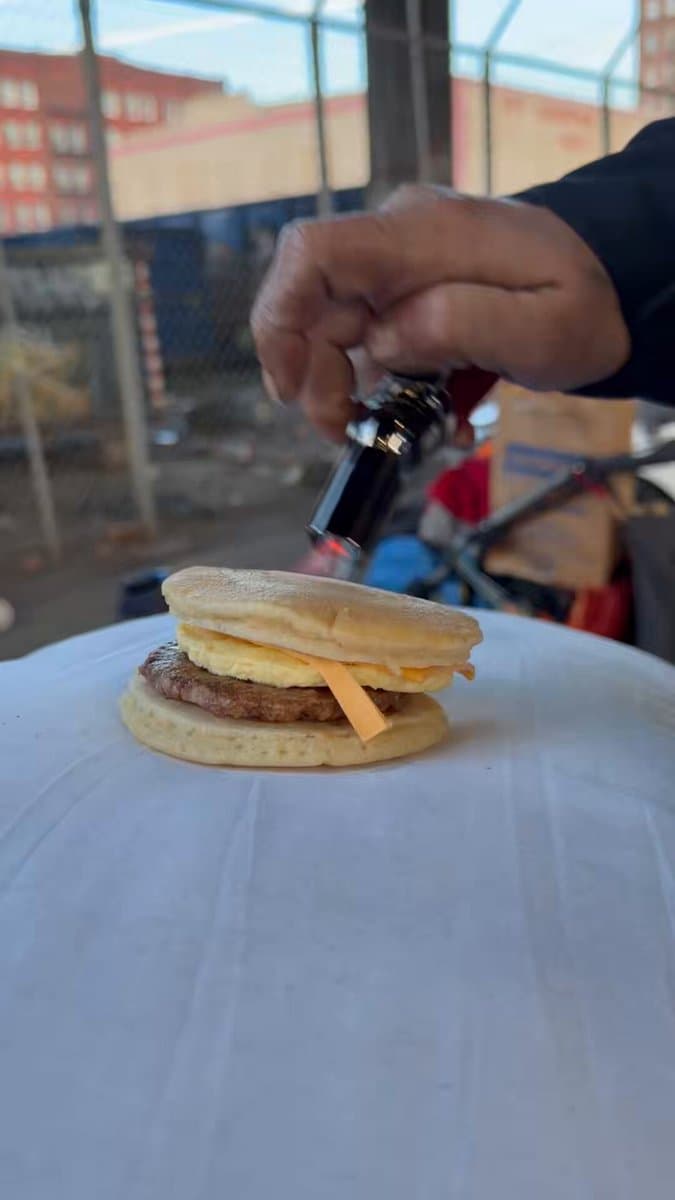 Image for Street Scene: Man Reheats Egg McMuffin with Torch in Viral Kevin Dahlgren Post