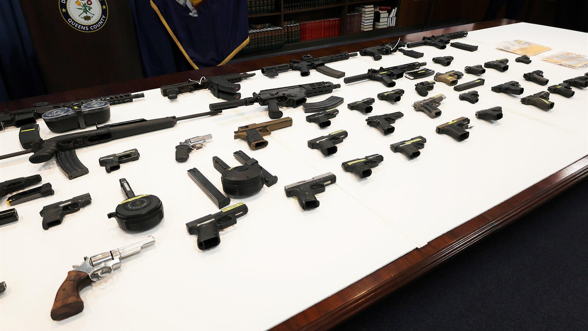 Image for 77 Firearms Seized in Queens, Disrupting 'Iron Pipeline' Gun Trafficking Ring